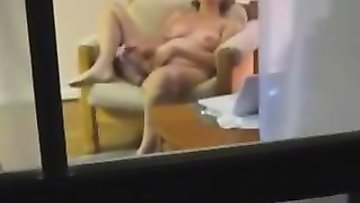 Voyeuring my mama toying in the living room when she is all alone