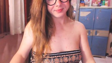 Blonde Shemale sucking a huge Dildo