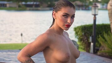 Glamorous all natural Emjay Rinaudo stripped and posed by the swimming pool outside