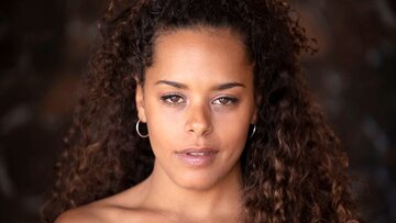 Curly hair ebony teen model with Playboy