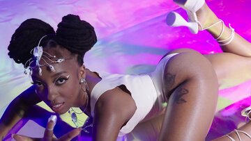 Inked Ebony MILF With Huge Natural Tits Poses Nude