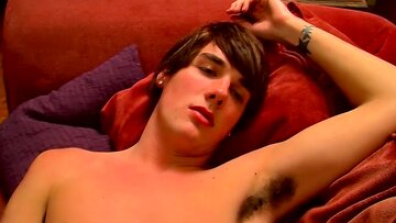 Slim twink blasts a cumshot on himself after